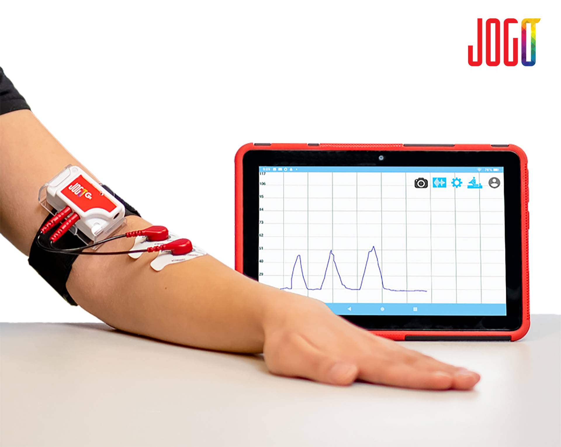 A patient using a JOGO health monitoring device with a monitor.